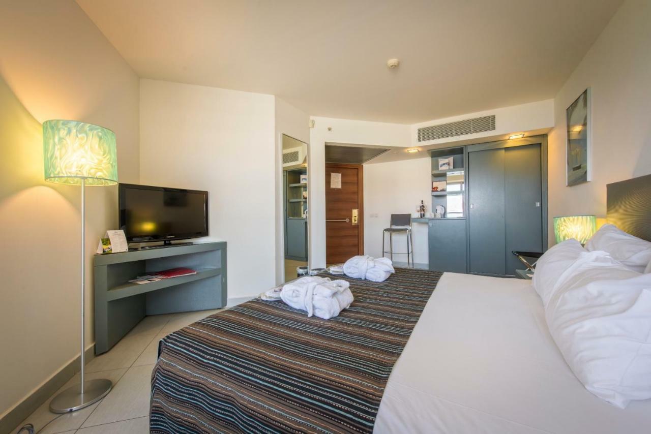 Neptune Eilat By Dan Hotels Bagian luar foto A room at the hotel